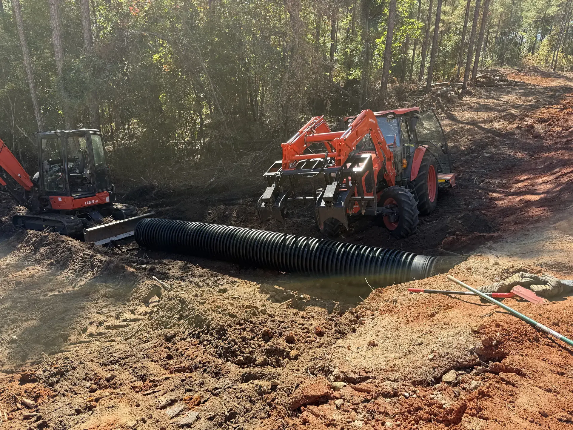 Culvert pipe installation with excavation equipment