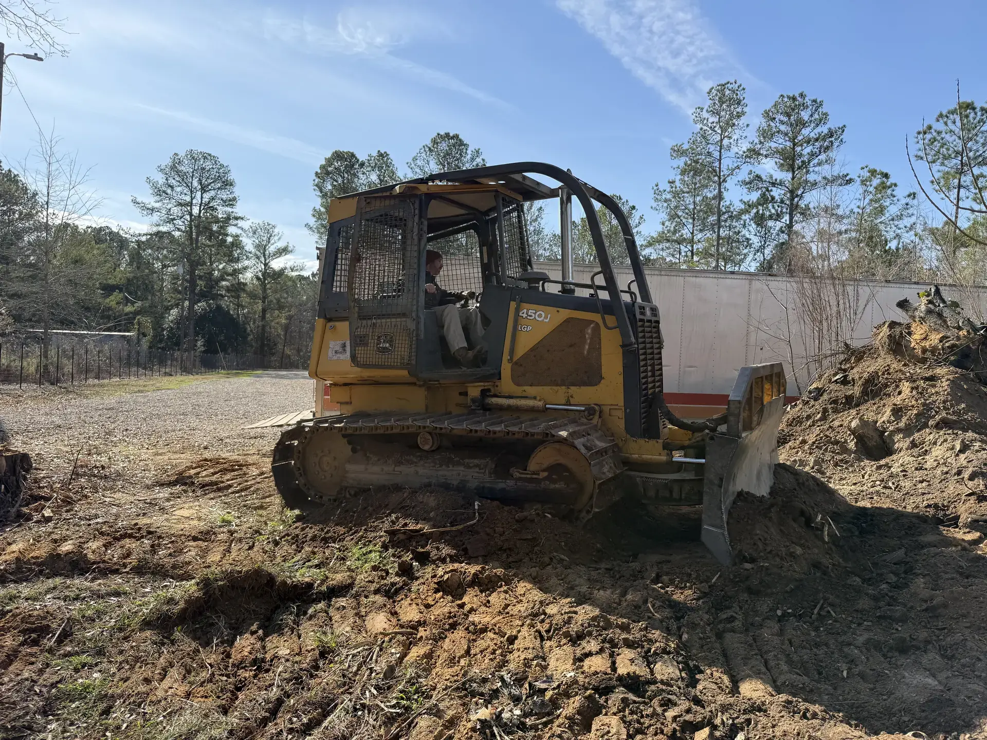 Dozer shaping and grading soil on a jobsite