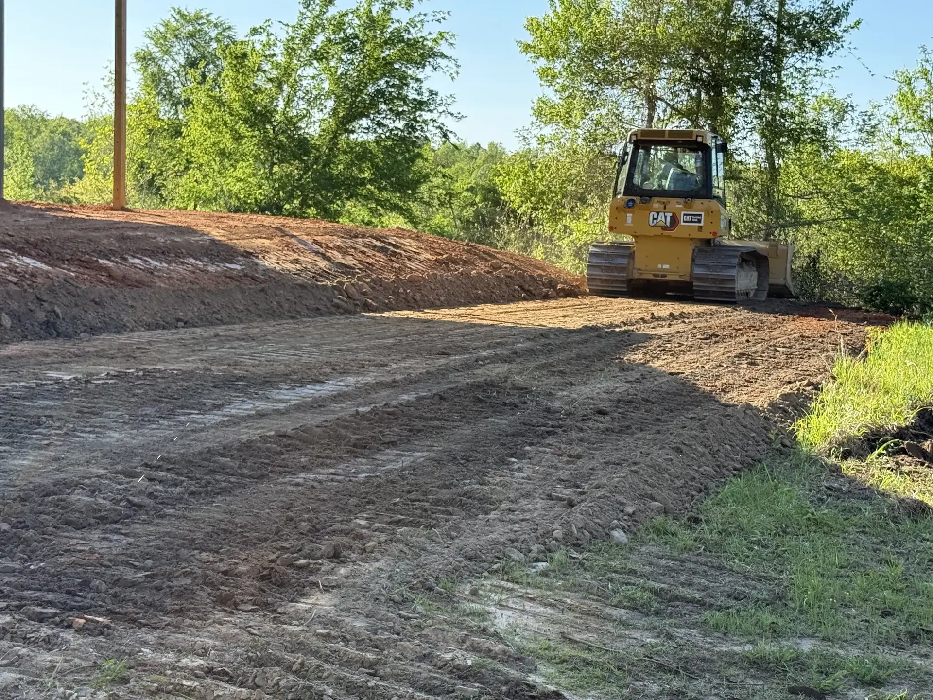 Dozer completing finish grading on a cleared property